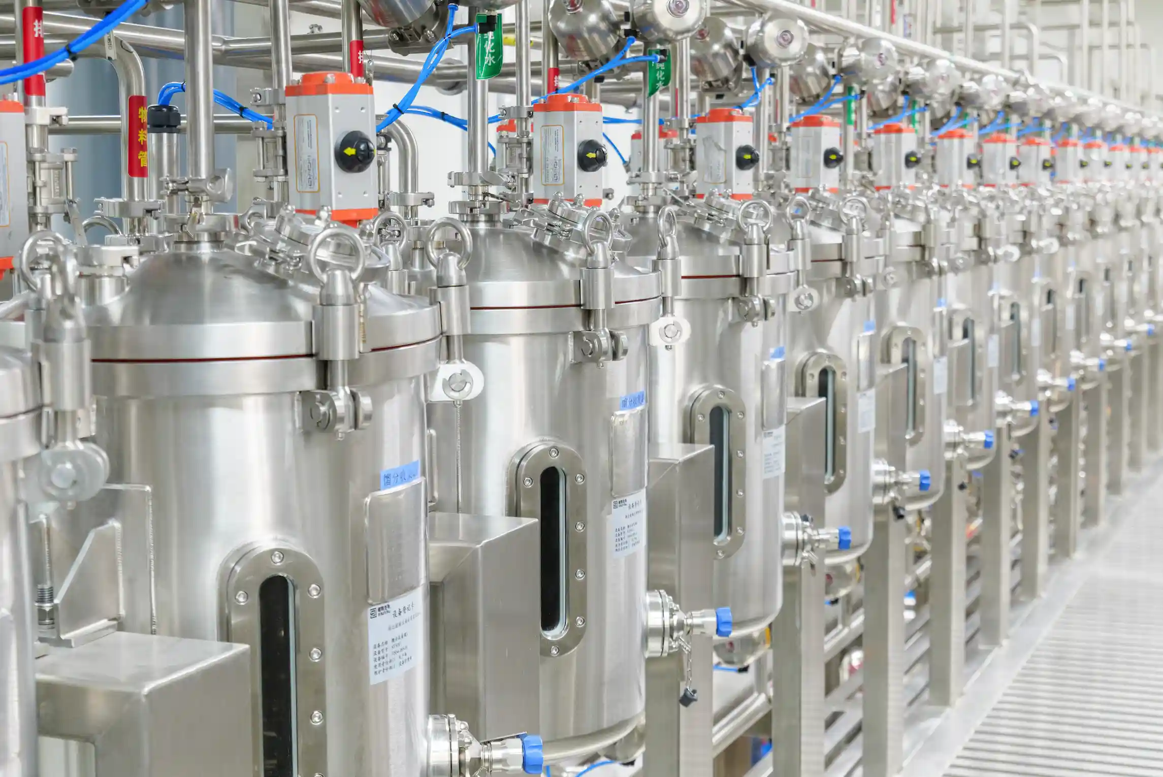Stainless steel bioreactors in a pharmaceutical facility used for peptide and API manufacturing processes