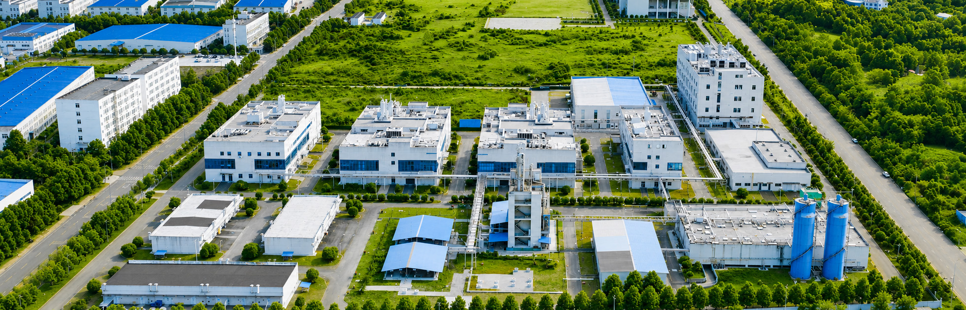 Automated capping equipment sealing sterile liquid vials in pharmaceutical manufacturing.