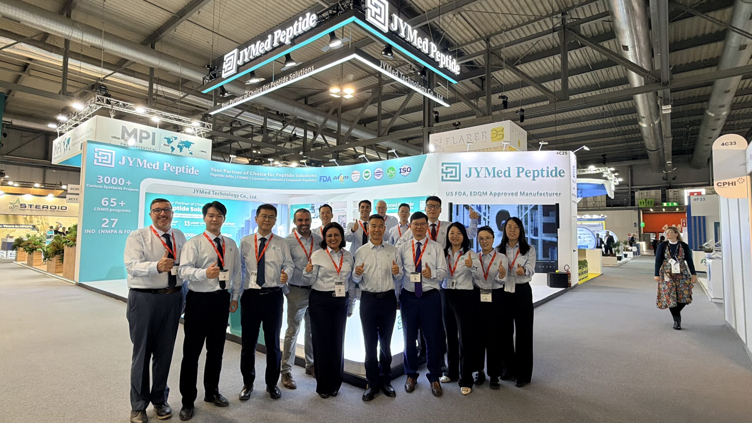 JYMed Peptide Team Group Photo at CPHI Milan 2026 JYMed Peptide team members posing for a group photo in front of their exhibition booth at CPHI Milan 2026.